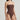 Brown strapless swimsuit worn by a model on a light gray background