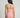 Person wearing a pink strapless swimsuit against a gray background