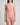 Woman wearing a pink strapless swimsuit against a plain background
