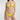 Woman wearing a yellow bikini against a white background