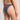 Person wearing a dark blue bikini bottom on a neutral background