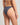 Person wearing a dark blue bikini bottom on a neutral background