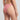 Person wearing a pink bikini bottom on a plain background