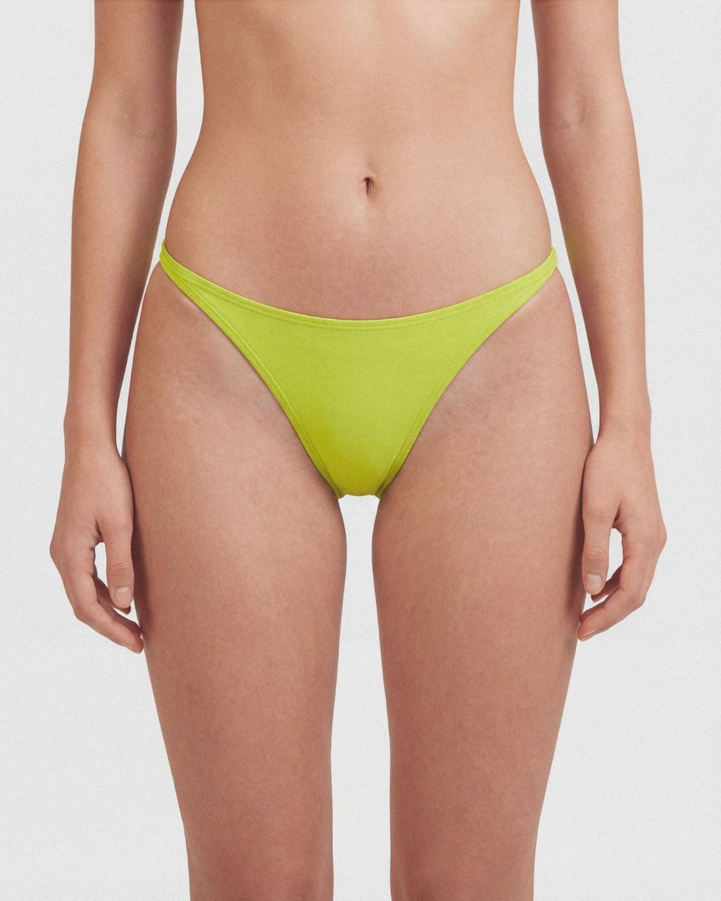 Green bikini bottom on a plain background