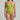 Woman wearing a green swimsuit against a plain background