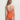 Woman wearing an orange swimsuit on a white background