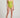 Person wearing a green one-piece swimsuit on a plain background