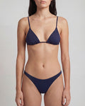 Navy blue bikini set on a plain background