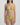 Woman wearing a green bikini against a plain background