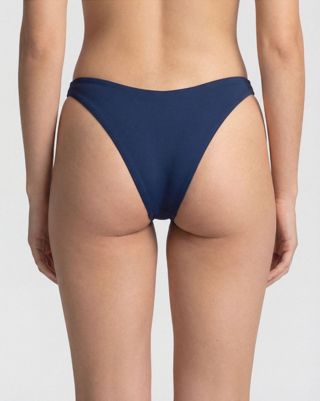 Navy blue bikini bottom on a plain background
