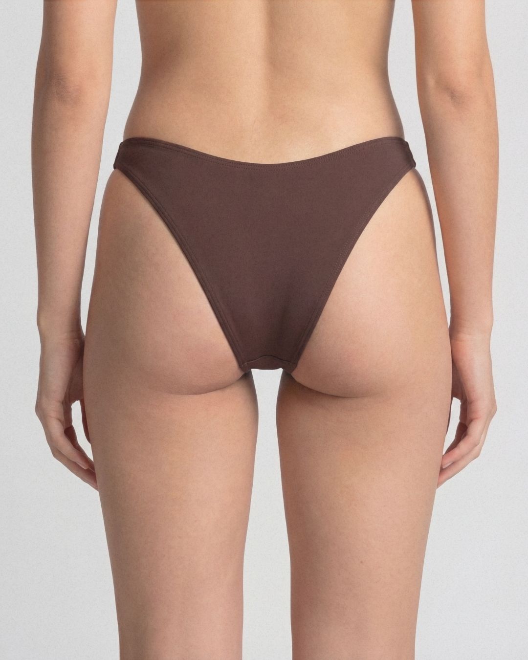 Brown bikini bottom on a plain background