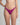 Person wearing a bright pink bikini bottom on a plain background