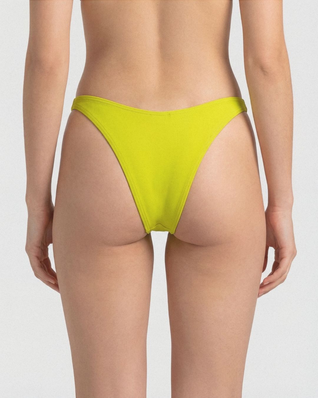 Yellow bikini bottom on a plain background