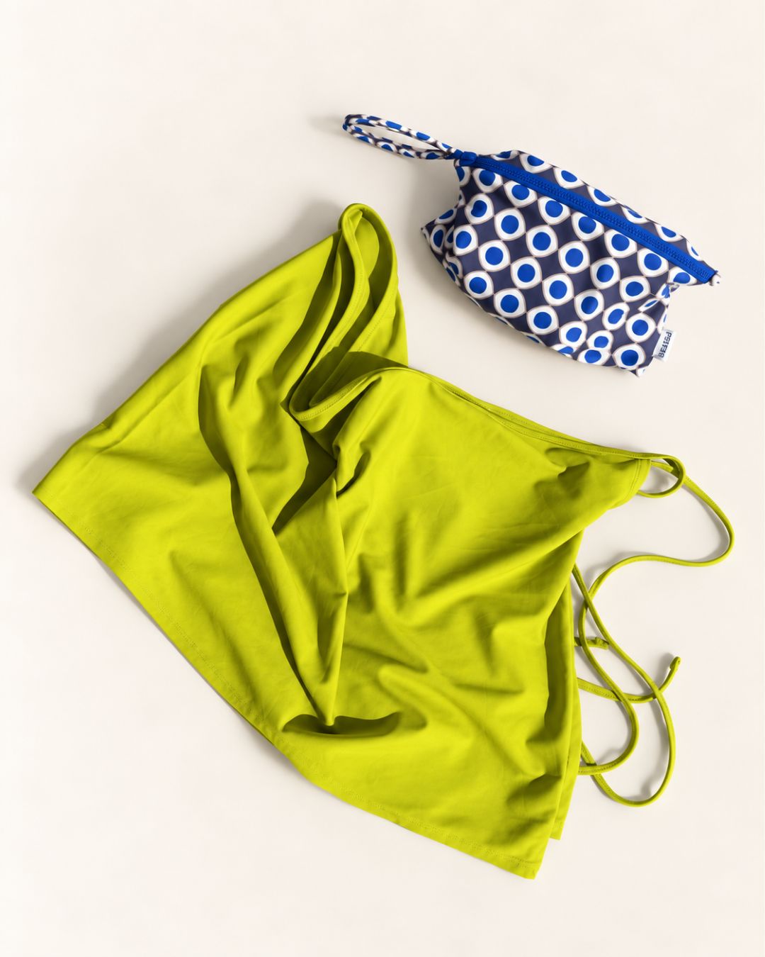 Masarà Yaya Sarong in Pistachio Green with the Occhio print zip pouch