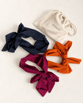 Three Masarà Pirate Headbands in Blueberry Blue, Grape Purple and Paprika Orange