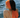 woman wearing orange headband by the sea