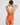 Back view of Niki One Piece tank swimsuit in paprika orange, showcasing sleek design and thin straps for full coverage.