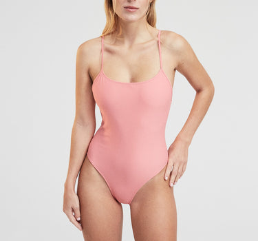 Niki One Piece Cherry Blossom Pink tank style swimsuit made in Italy, featuring thin straps and a minimalistic design.