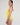 Side view of the Niki One Piece Swimsuit in bright yellow, highlighting its minimalist and elegant design.