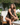 Woman sitting outdoors on a chair with a blurred background