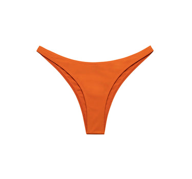 Penelope Brazil Bikini Slip in bold paprika orange, cheeky briefs, sustainable swimwear made in Italy.