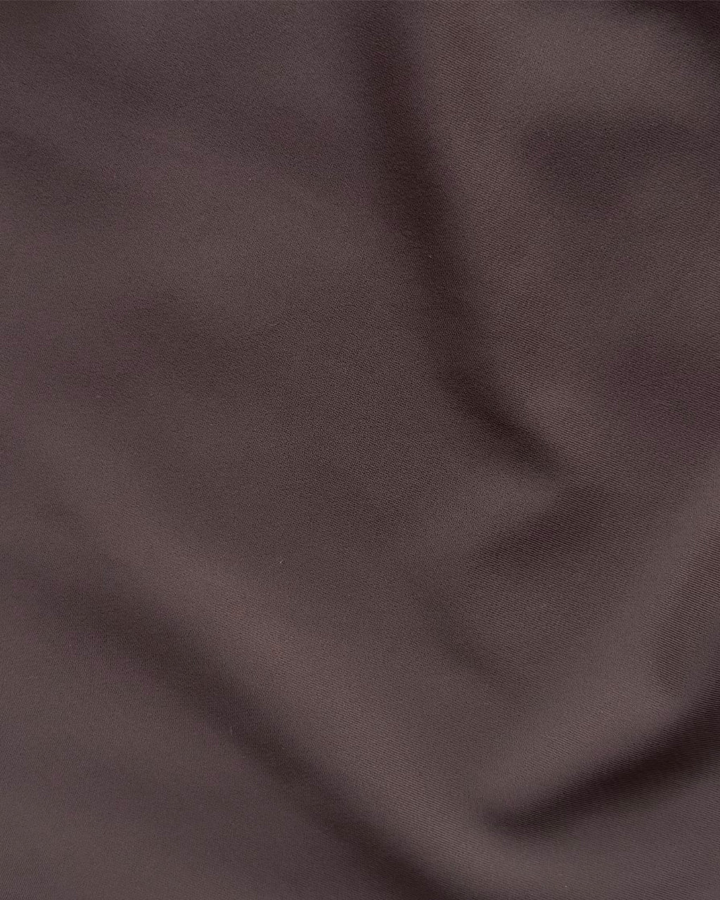 Close-up of dark brown regenerated nylon fabric texture