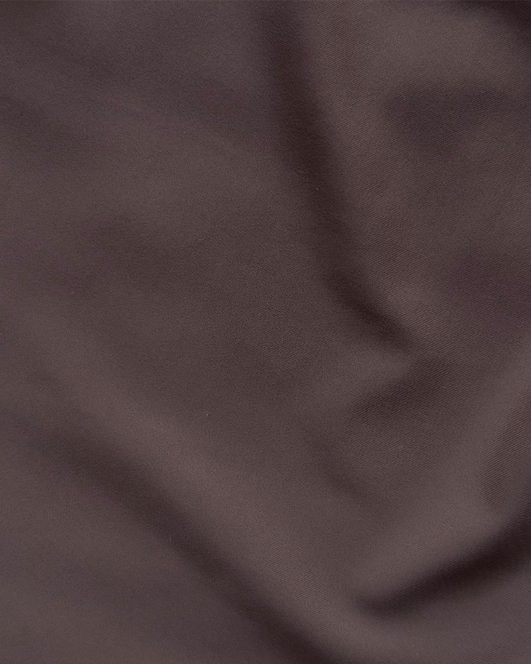 Close-up of dark brown regenerated nylon fabric texture
