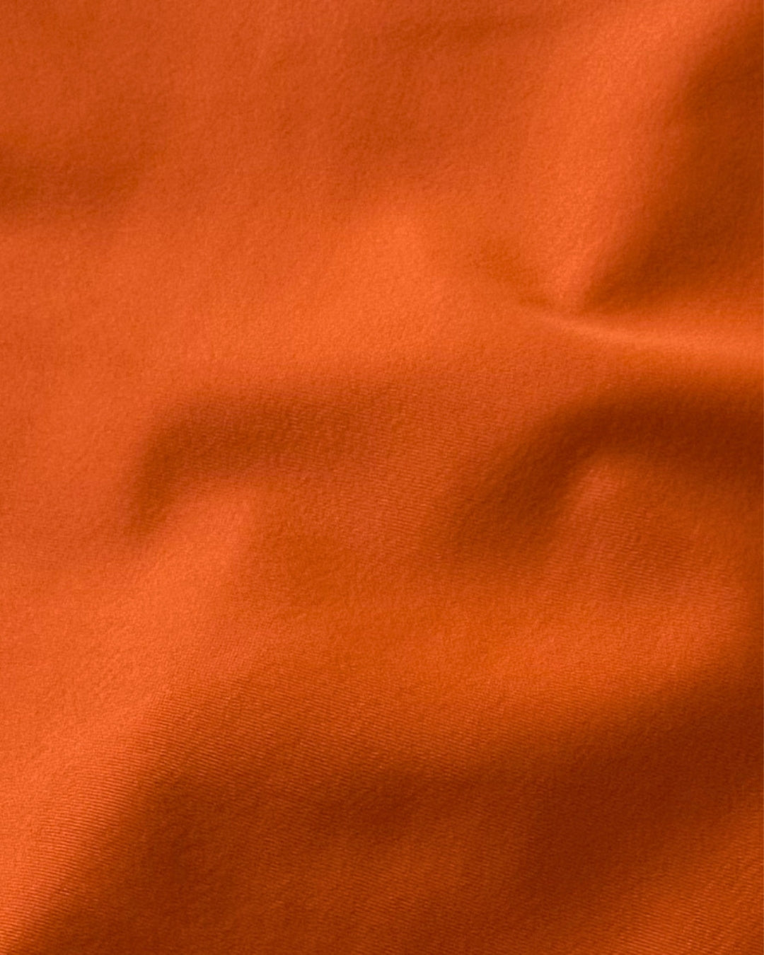 Close-up of orange regenerated nylon  fabric texture