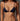 Woman wearing a navy blue bikini against a neutral background