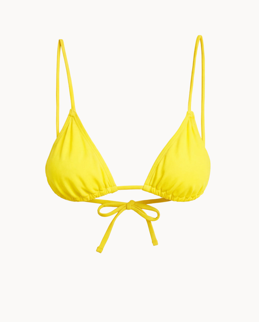Yellow bikini top with thin straps on a white background