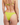 Person wearing a green bikini on a plain background
