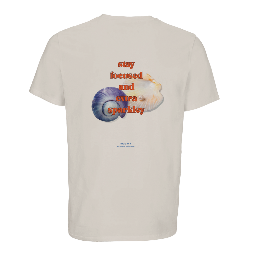 The stay focused and extra sparkley artwork on the Sparkley Shell Tee