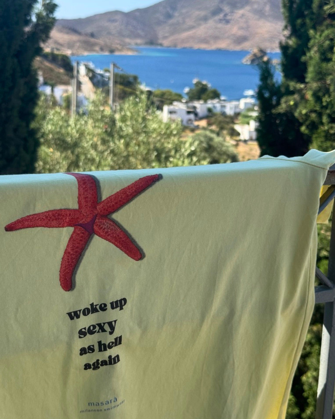 Model wearing the Sexy as Hell Tee, with the woke up sexy as hell again artwork printed on the back